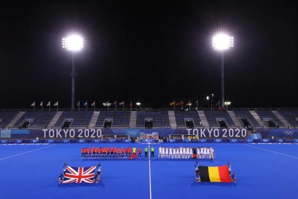 Players of both teams line up for national anthems prior to the Men's Preliminary Pool B match between Belgium and Great Britain on day seven of the...