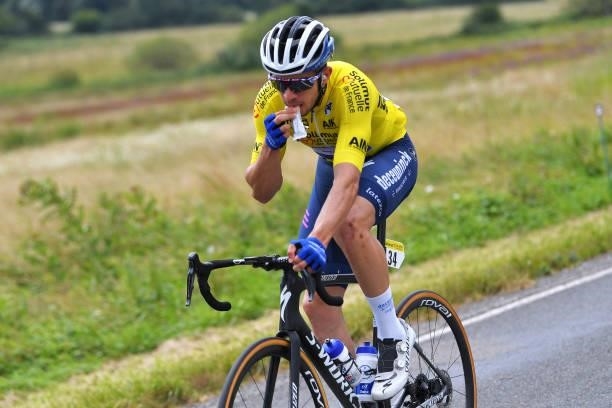 Álvaro José Hodeg Chagui of Colombia and Team Deceuninck - Quick-Step Yellow Leader Jersey rides whilst eating during the 33rd Tour de l'Ain 2021,...