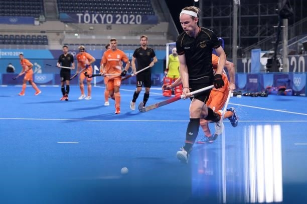 Jan Christopher Ruhr of Team Germany runs with the ball during the Men's Preliminary Pool B match between Germany and Netherlands on day seven of the...