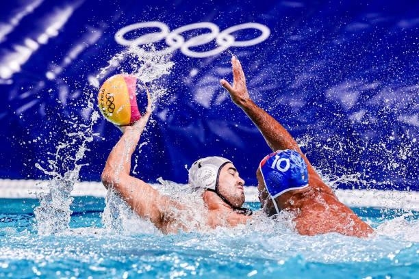 Ben Hallock of United States, Michael Bodegas of Italy during the Tokyo 2020 Olympic Waterpolo Tournament Men match between Team United States and...