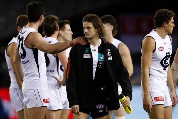 Dejected Hunter Clark of the Saints walks from the ground after the round 20 AFL match between St Kilda Saints and Carlton Blues at Marvel Stadium on...