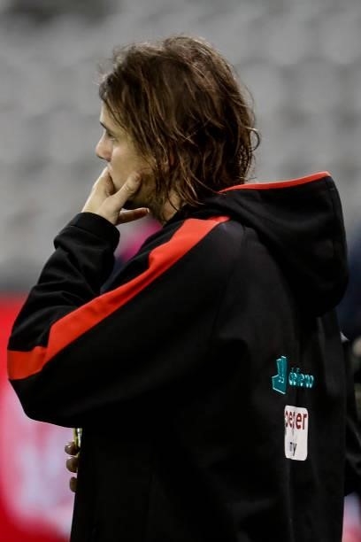 Hunter Clark of the Saints reaches for his jaw after the round 20 AFL match between St Kilda Saints and Carlton Blues at Marvel Stadium on July 30,...