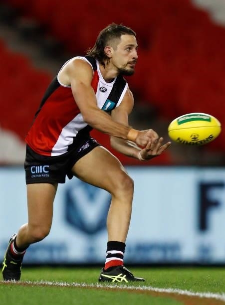 Ben Long of the Saints handballs during the round 20 AFL match between St Kilda Saints and Carlton Blues at Marvel Stadium on July 30, 2021 in...