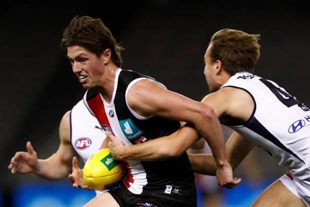 Leo Connolly of the Saints breaks a tackle during the round 20 AFL match between St Kilda Saints and Carlton Blues at Marvel Stadium on July 30, 2021...