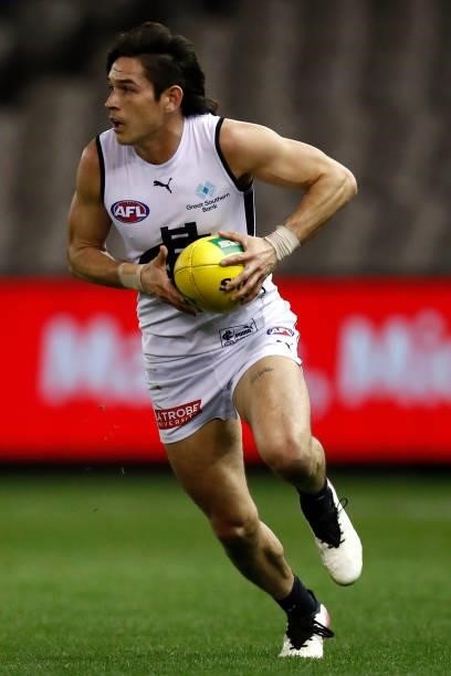 Zac Fisher of the Blues runs with the ball during the round 20 AFL match between St Kilda Saints and Carlton Blues at Marvel Stadium on July 30, 2021...