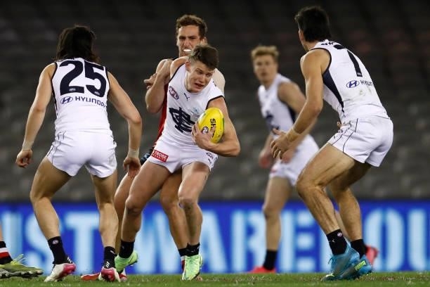 Luke Dunstan of the Saints tackles Sam Walsh of there Blues during the round 20 AFL match between St Kilda Saints and Carlton Blues at Marvel Stadium...