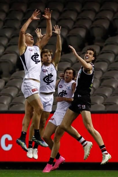 Max King of the Saints is outnumbered by Carlton players Liam Jones, Lochie O'Brien and Lachie Plowman in a marking contest during the round 20 AFL...