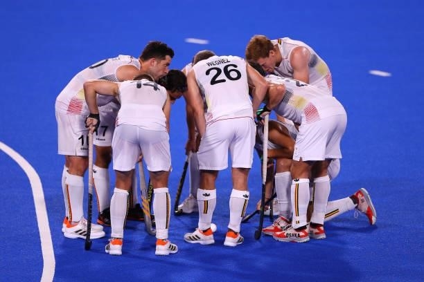 Team Belgium huddle during the Men's Preliminary Pool B match between Belgium and Great Britain on day seven of the Tokyo 2020 Olympic Games at Oi...