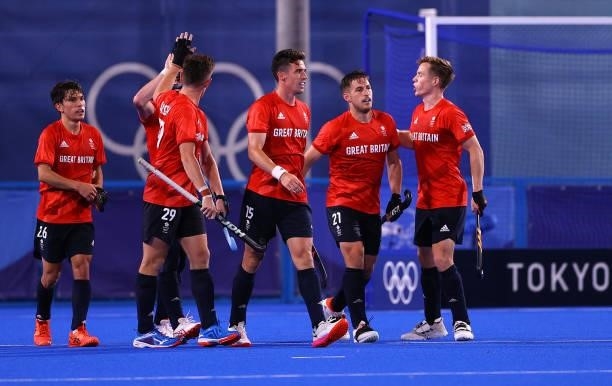 Liam Paul Ansell of Team Great Britain celebrates with teammates after scoring their team's second goal during the Men's Preliminary Pool B match...