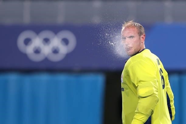 Pirmin Blaak of Team Netherlands spits out their drink during the Men's Preliminary Pool B match between Germany and Netherlands on day seven of the...