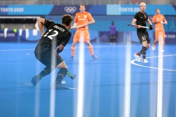 Tim Alexander Herzbruch of Team Germany controls the ball during the Men's Preliminary Pool B match between Germany and Netherlands on day seven of...