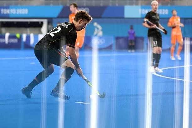 Tim Alexander Herzbruch of Team Germany controls the ball during the Men's Preliminary Pool B match between Germany and Netherlands on day seven of...