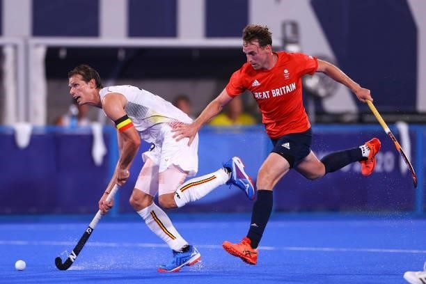 Felix Veronique B. Denayer of Team Belgium and Christopher Griffiths of Team Great Britain battle for the ball during the Men's Preliminary Pool B...
