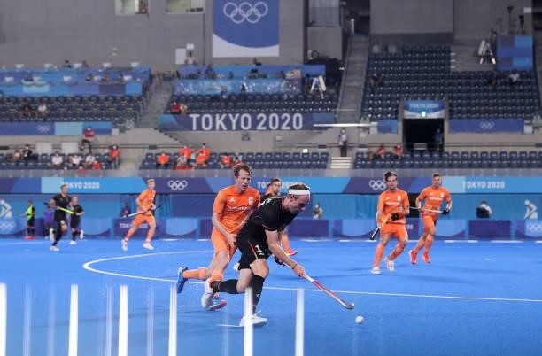 Jan Christopher Ruhr of Team Germany runs with the ball whilst under pressure from Severiano Boris van Ass of Team Netherlands during the Men's...
