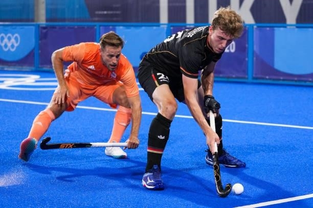 Jeroen Hertzberger of the Netherlands and Niklas Bosserhoff of Germany competing on Men's Pool B during the Tokyo 2020 Olympic Games at the Oi Hockey...