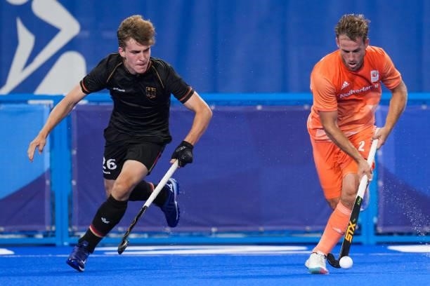 Niklas Bosserhoff of Germany and Jeroen Hertzberger of the Netherlands competing on Men's Pool B during the Tokyo 2020 Olympic Games at the Oi Hockey...