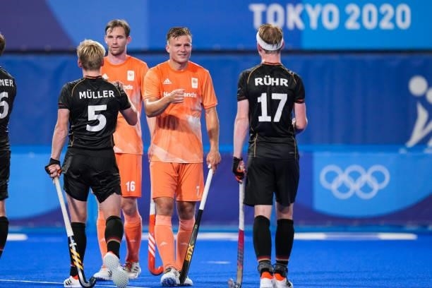 Linus Muller of Germany, Mirco Pruijser of the Netherlands, Thijs van Dam of the Netherlands and Jan Christopher Ruhr of Gemany shake hands while...