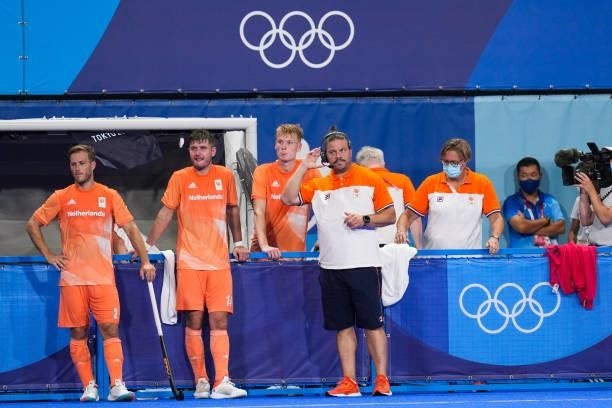 Jeroen Hertzberger of the Netherlands, Robbert Kemperman of the Netherlands and Coach Max Caldas of the Netherlands competing on Men's Pool B during...