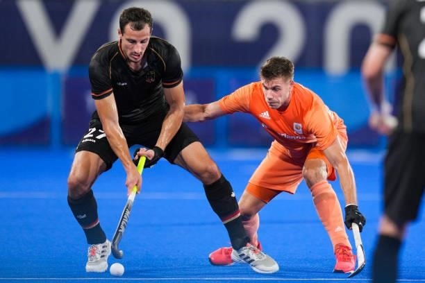 Timur Oruz of Germany and Robbert Kemperman of the Netherlands competing on Men's Pool B during the Tokyo 2020 Olympic Games at the Oi Hockey Stadium...