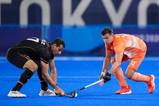 Timur Oruz of Germany and Sander de Wijn of the Netherlands competing on Men's Pool B during the Tokyo 2020 Olympic Games at the Oi Hockey Stadium on...