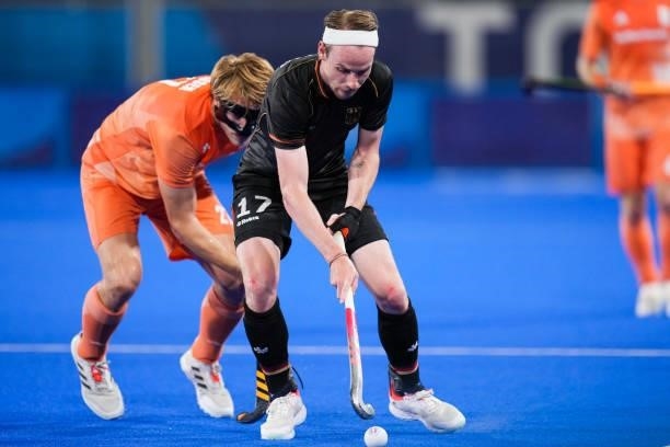 Jip Janssen of the Netherlands and Jan Christopher Ruhr of Germany competing on Men's Pool B during the Tokyo 2020 Olympic Games at the Oi Hockey...
