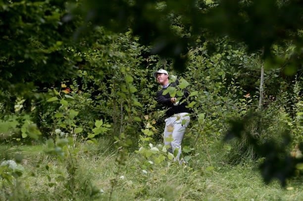 Sihwan Kim of Korea plays from the trees on the 18th hole during Day Two of The ISPS HANDA World Invitational at Galgorm Spa & Golf Resort on July...