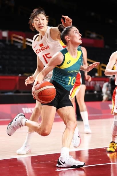 Katie Ebzery of Team Australia drives to the basket against Xu Han of Team China during the second half of a Women's Basketball Preliminary Round...