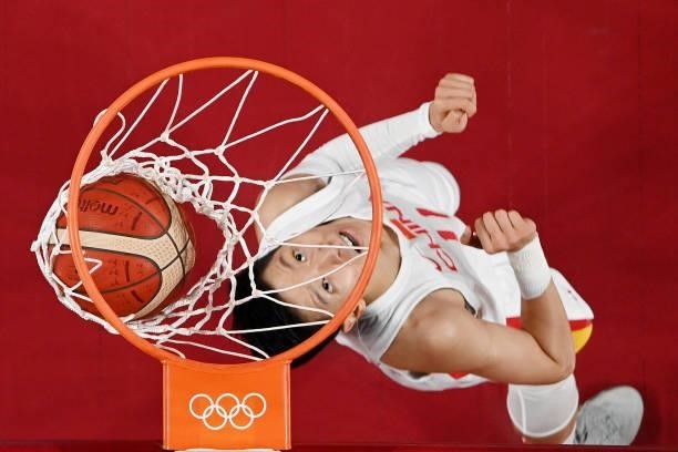 Sijing Huang of Team China watches the ball go into the basket against Australia during the second half of a Women's Basketball Preliminary Round...