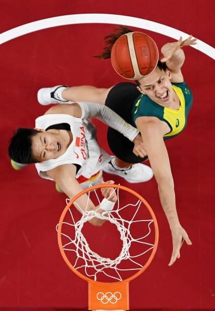 Marianna Tolo of Team Australia drives to the basket against Sijing Huang of Team China during the second half of a Women's Basketball Preliminary...