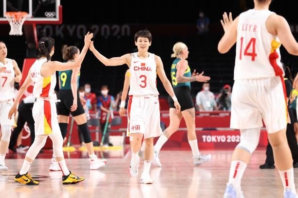 Liwei Yang of Team China high-fives a teammates during the second half of their Women's Basketball Preliminary Round Group C game against Australia...