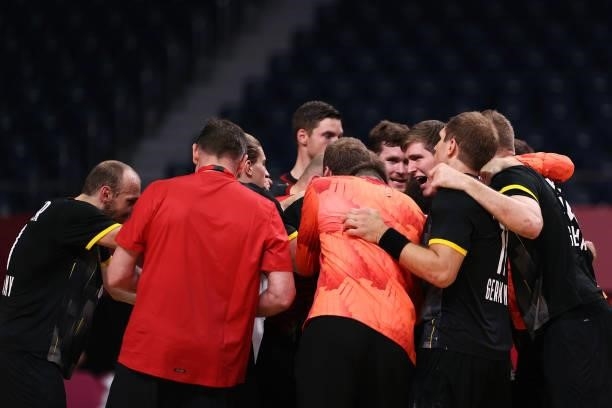 Team Germany celebrate after winning the Men's Preliminary Round Group A handball match between Germany and Norway on day seven of the Tokyo 2020...