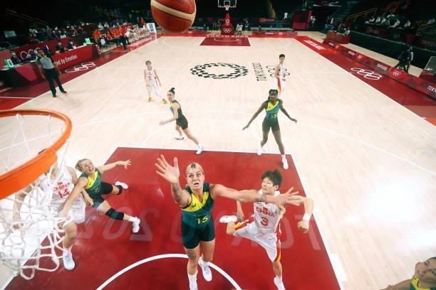 Liwei Yang of Team China drives to the basket against Cayla George of Team Australia during the second half of a Women's Basketball Preliminary Round...