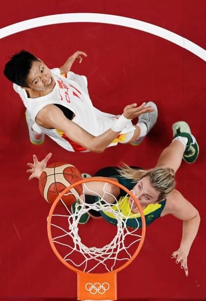 Sijing Huang of Team China and Liz Cambage of Team Australia fight for go up for a rebound during the second half of a Women's Basketball Preliminary...