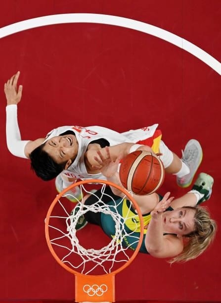 Sijing Huang of Team China and Liz Cambage of Team Australia fight for go up for a rebound during the second half of a Women's Basketball Preliminary...
