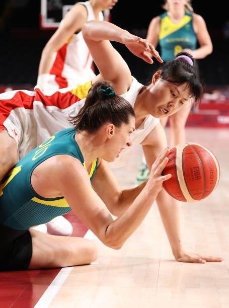 Yueru Li of Team China and Marianna Tolo of Team Australia foght for possession of the ball in a scrum during the second half of a Women's Basketball...