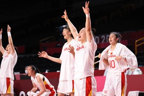 Members of Team China cheer on their team from the bench during the first half of their Women's Basketball Preliminary Round Group B game against...