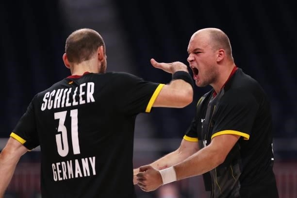 Marcel Schiller and Paul Drux of Team Germany celebrate after winning the Men's Preliminary Round Group A handball match between Germany and Norway...