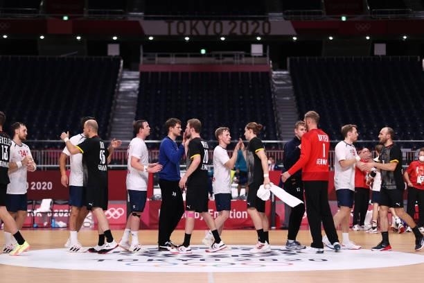 Players congratulate each other after the Men's Preliminary Round Group A handball match between Germany and Norway on day seven of the Tokyo 2020...
