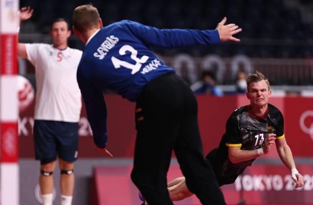Timo Kastening of Team Germany shoots and scores a goal against Kristian Saeveraas of Team Norway during the Men's Preliminary Round Group A handball...