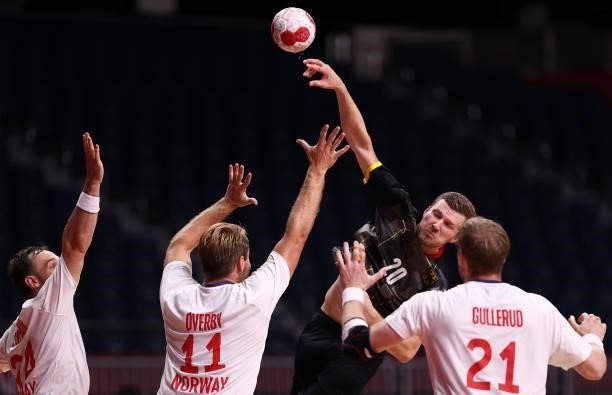 Philipp Weber of Team Germany shoots at goal as Christian O'Sullivan, Petter Oeverby and Magnus Gullerud of Team Norway defend during the Men's...
