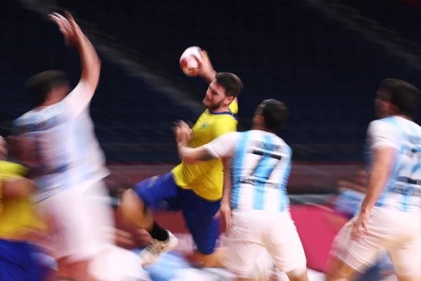 Haniel Langaro of Team Brazil attempts to shoot at goal whilst being challenged by Nicolas Bonanno of Team Argentina during the Men's Preliminary...