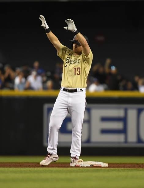 Josh VanMeter of the Arizona Diamondbacks celebrates after hitting a two RBI double against the Los Angeles Dodgers during the second inning at Chase...