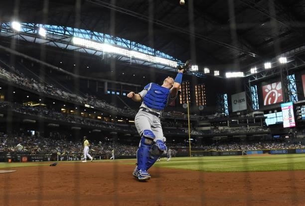 Will Smith of the Los Angeles Dodgers catches a pop foul hit by Nick Ahmed of the Arizona Diamondbacks during the second inning at Chase Field on...