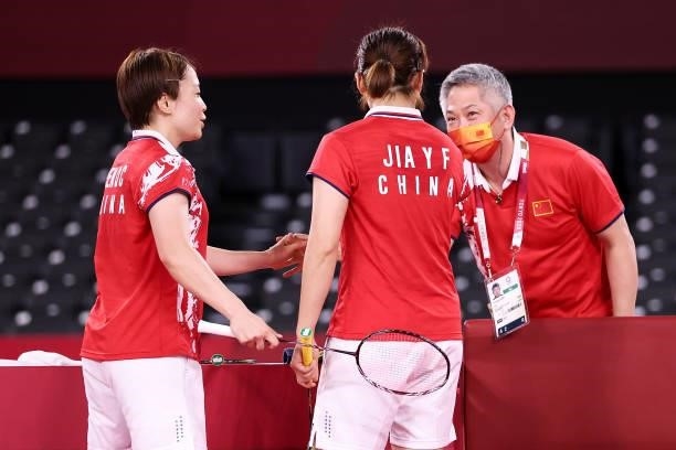Chen Qing Chen and Jia Yi Fan of Team China celebrate with their coach Kang Kyung-jin as they win against Kim Soyeong and Kong Heeyong of Team South...