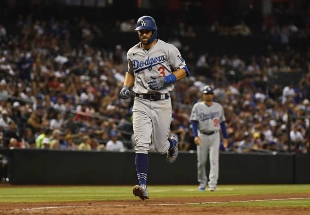 Chris Taylor of the Los Angeles Dodgers rounds the bases after hitting a solo home run against the Arizona Diamondbacks during the sixth inning at...