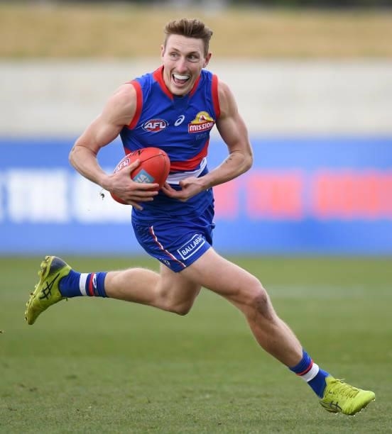 Bailey Dale of the Bulldogs runs with the ball during the round 19 AFL match between Western Bulldogs and Adelaide Crows at Mars Stadium on July 31,...