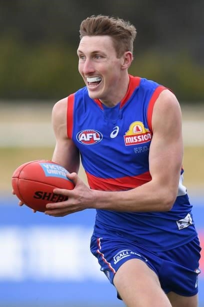 Bailey Dale of the Bulldogs runs with the ball during the round 19 AFL match between Western Bulldogs and Adelaide Crows at Mars Stadium on July 31,...