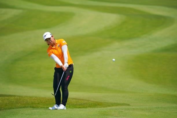 Mao Saigo of Japan makes a chip-in-birdie on the 11th green during the final round of Rakuten Super Ladies at Tokyu Grand Oak Golf Club on July 31,...