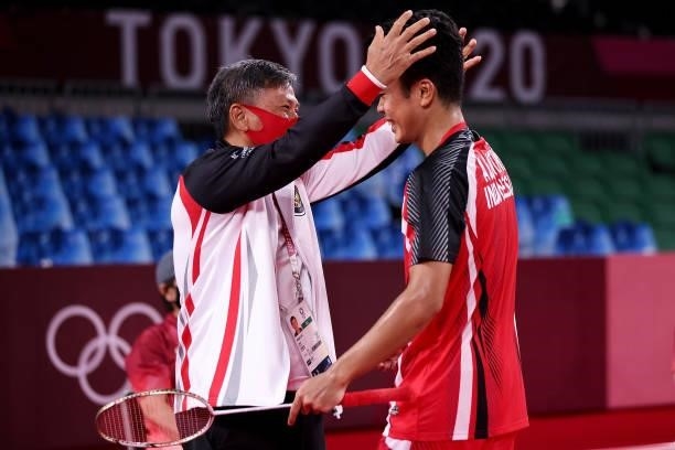 Anthony Sinisuka Ginting of Team Indonesia celebrates with his coach Hendry Ho as he wins against Anders Antonsen of Team Denmark during a Men's...