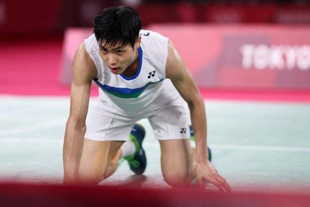 Chou Tien-chen of Team Chinese Taipei reacts as he competes against Chen Long of Team China during a Men's Singles Quarterfinal match on day eight of...